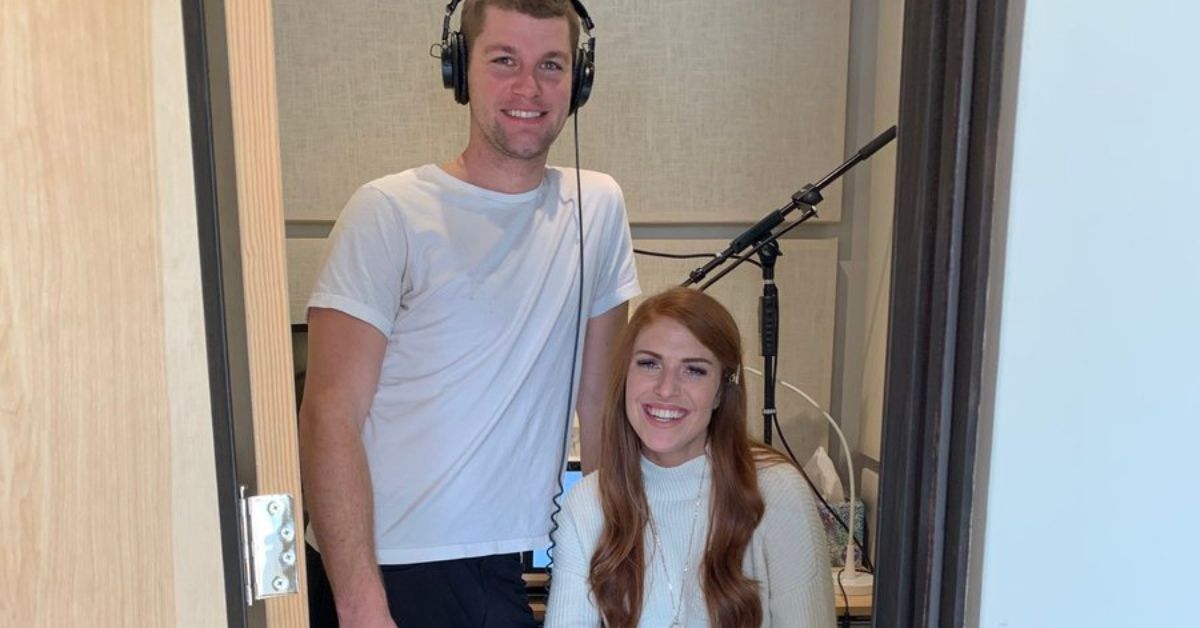Jeremy Roloff wearing headphones standing next to Audrey Roloff
