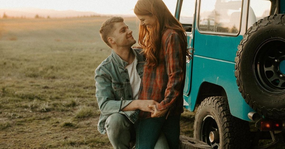Jeremy and Audrey Roloff staring at each other next to a truck