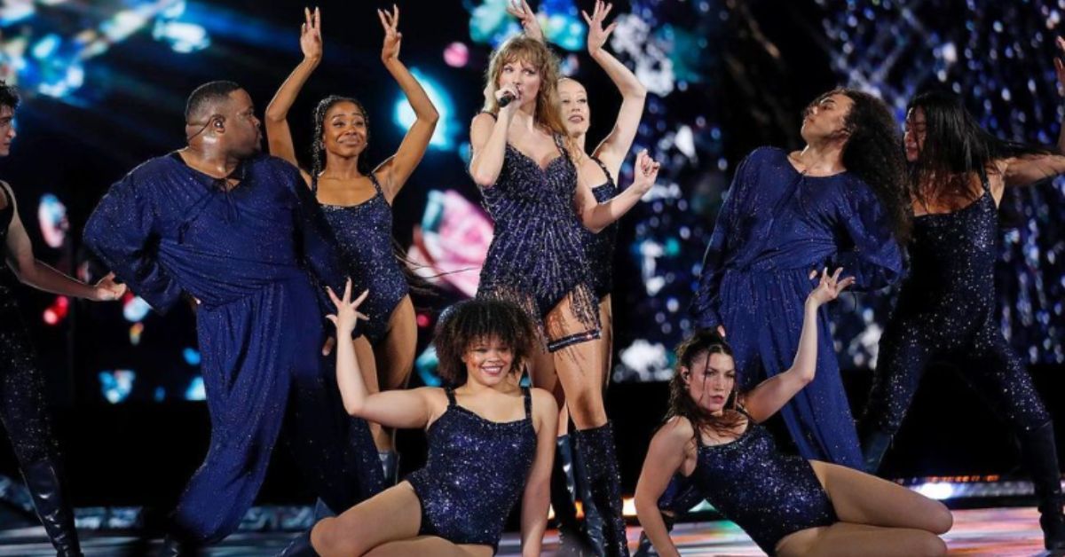 Taylor Swift on stage for era's tour all black sequins