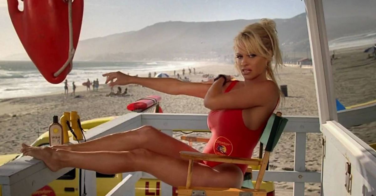 Pamela Anderson wearing her Baywatch swimsuit on the lifeguard tower