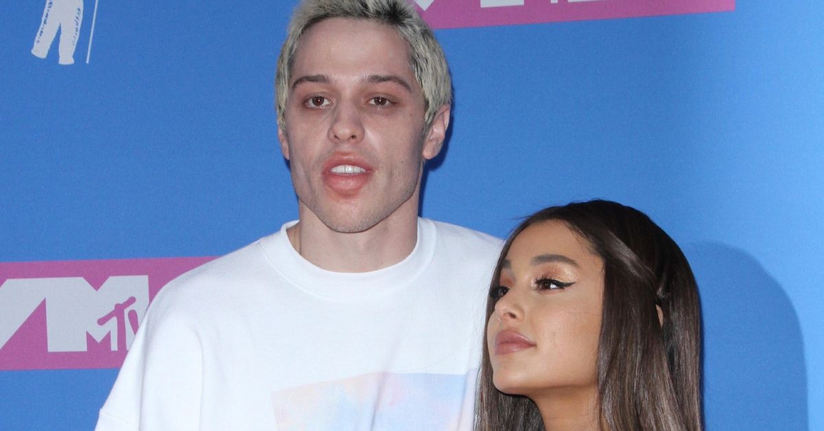 Pete Davidson and Ariana Grande standing together