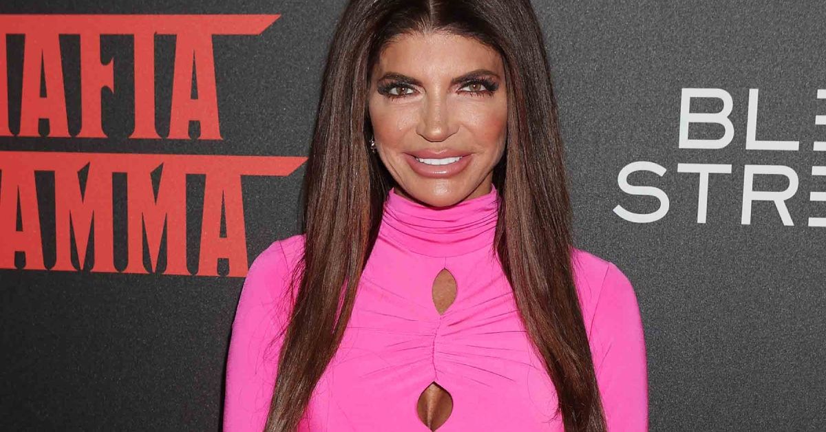 Teresa Giudice grinning against a backdrop