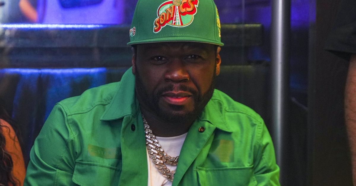 50 Cent posing in green hoodie 
