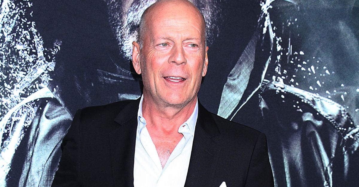 Bruce Willis posing for a photo
