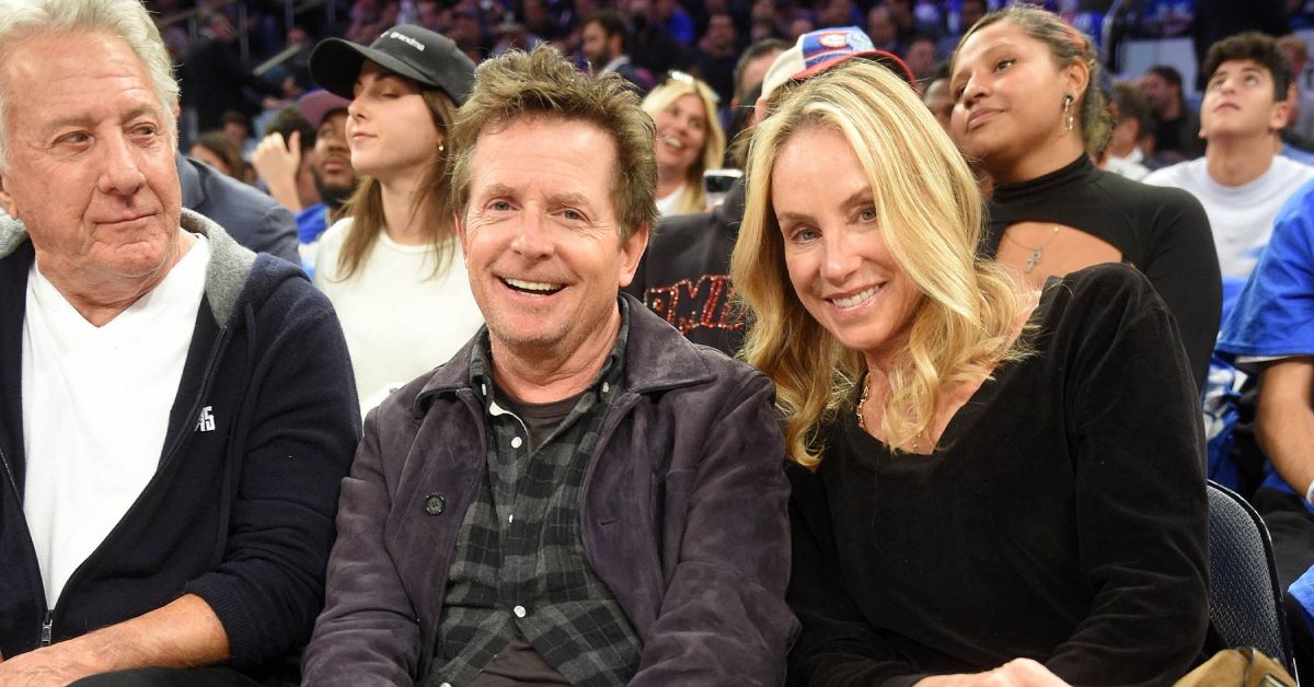 Dustin Hoffman, Michael J. Fox and Tracy Pollan at a sports game