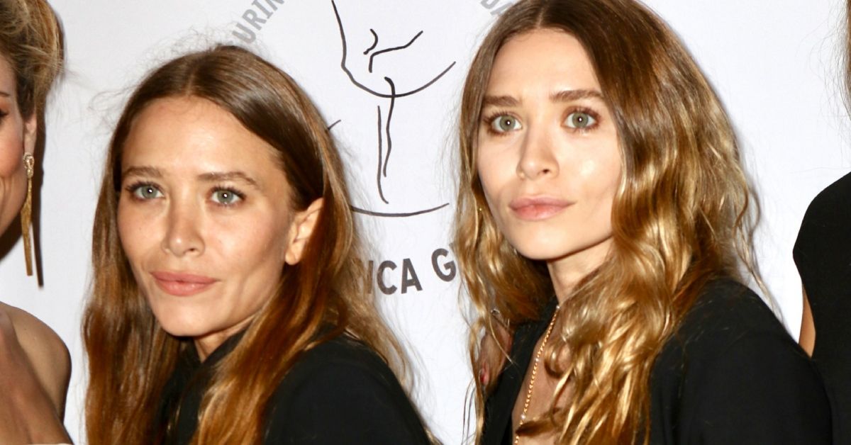 Mary-Kate and Ashley Olsen standing on the red carpet