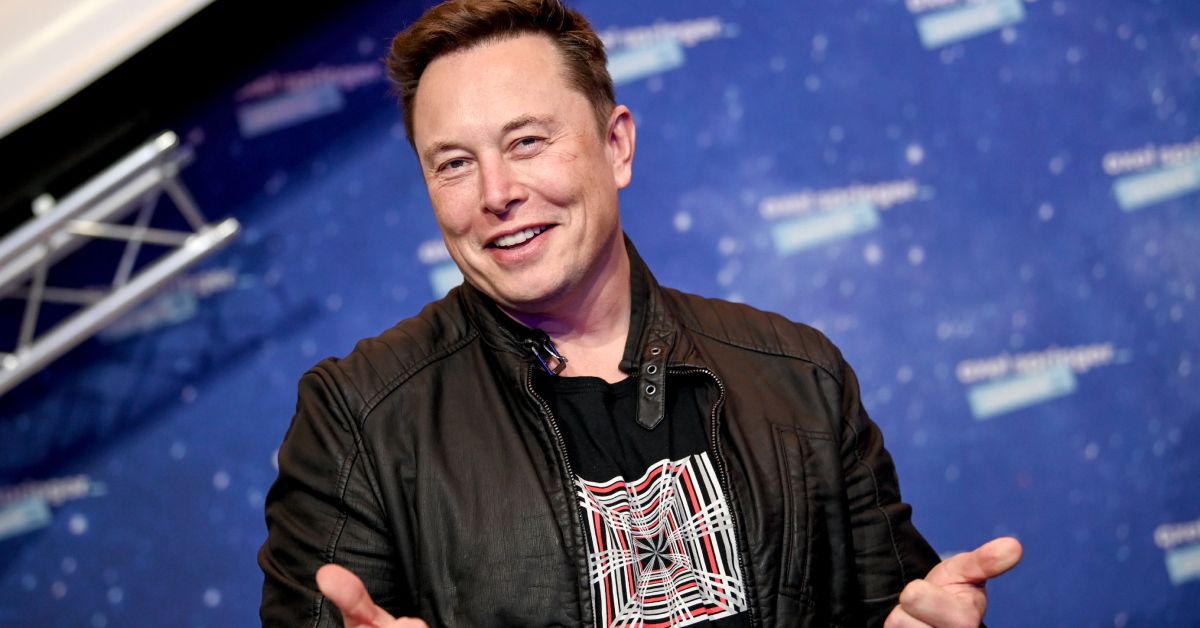 Elon Musk smiling with his thumbs up