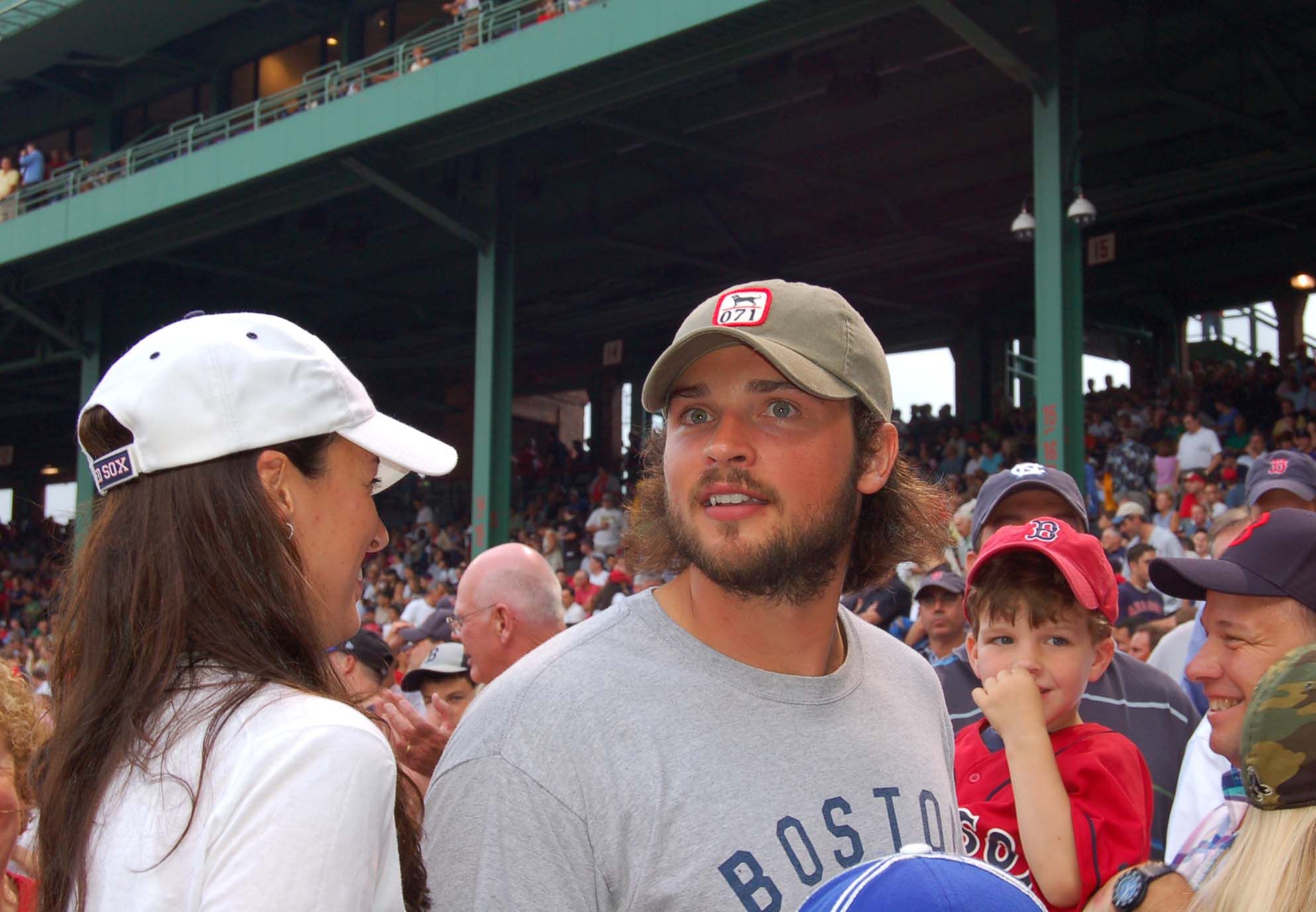 Tom Welling and Jamie White at baseball game
