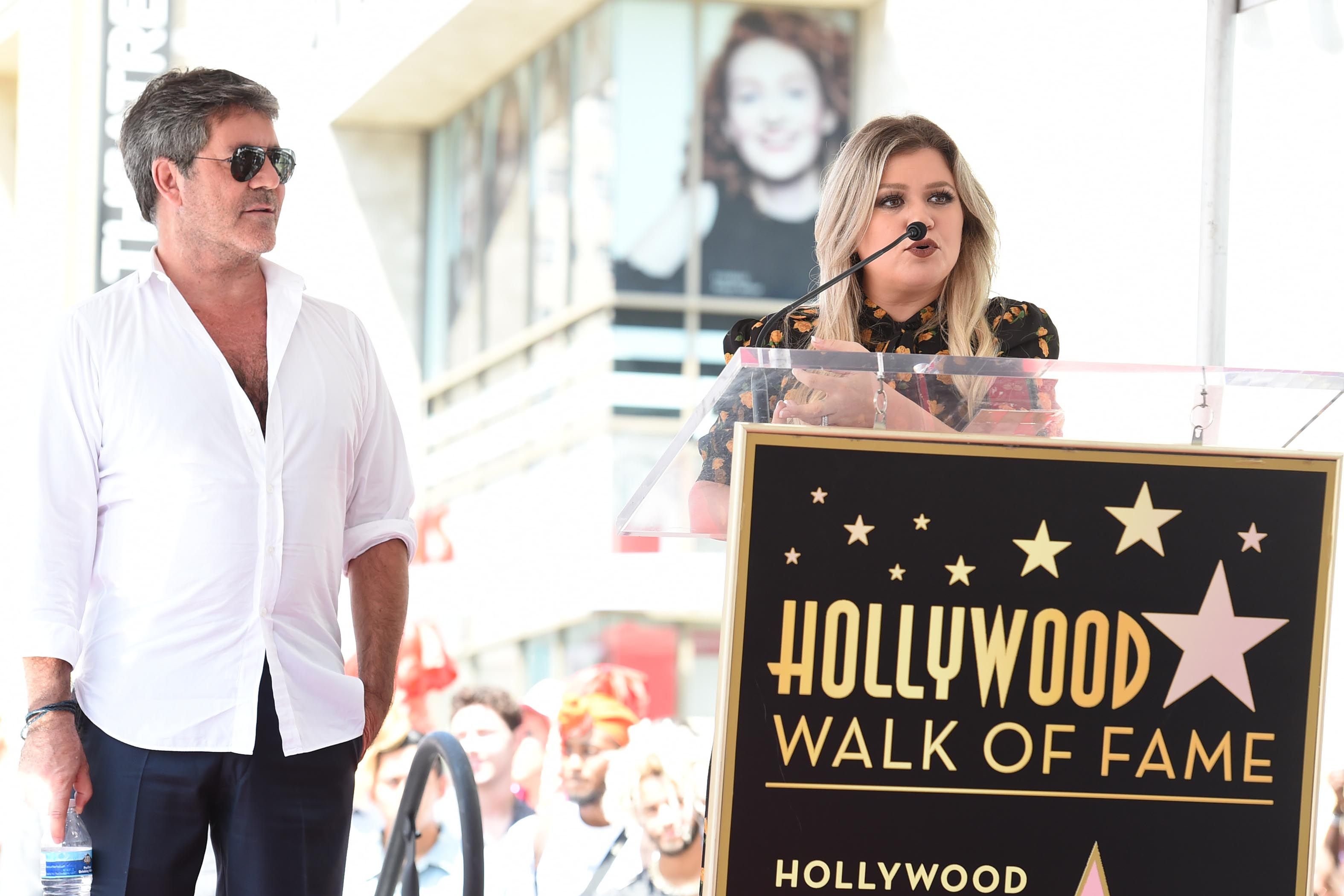 Simon Cowell receives star on Hollywood Walk of Fame with guest Kelly Clarkson