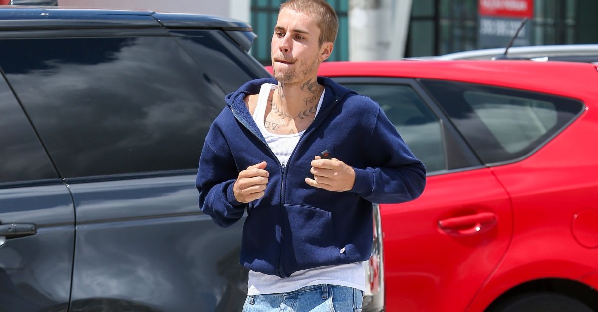 Justin Bieber walking through a parking lot