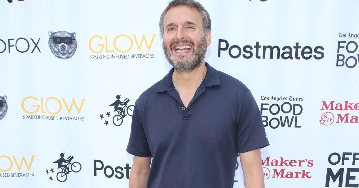 Phil Rosenthal smiling and standing on the red carpet