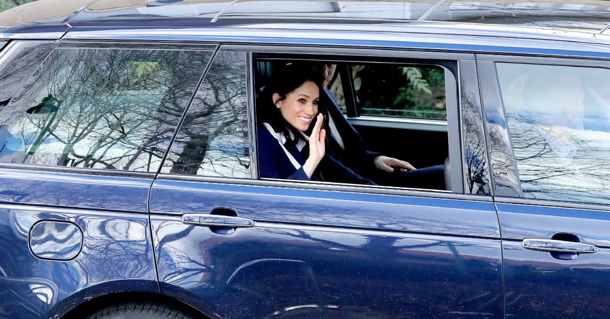 Prince Harry and Meghan Markle photographed in a vehicle