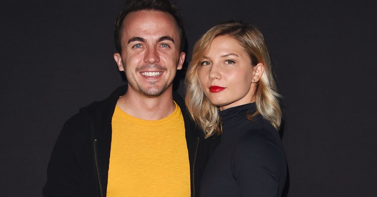 Frankie Muniz standing smiling with his wife Paige Price