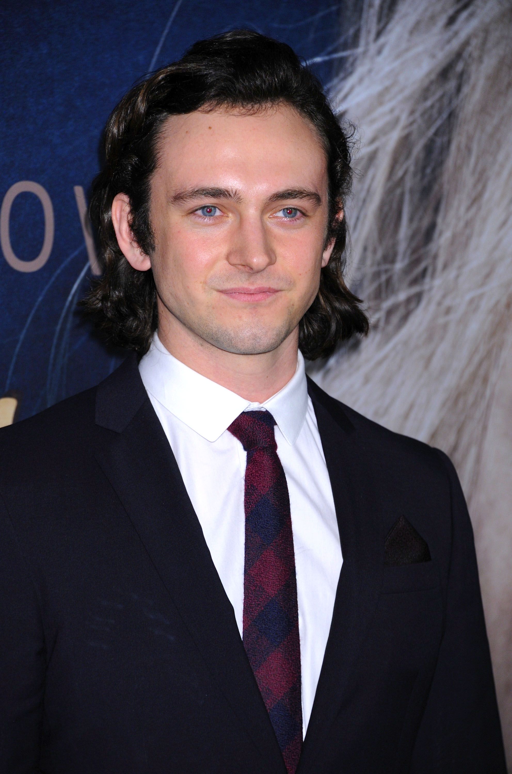 George Blagden in a suit