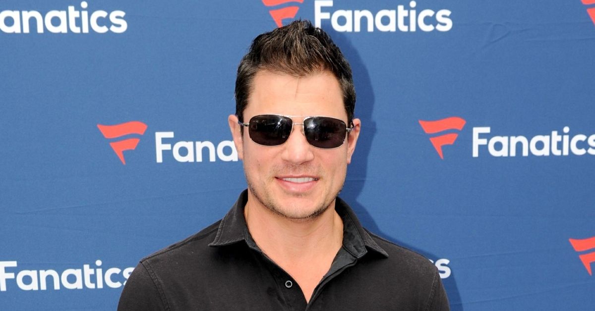 Nick Lachey wearing sunglasses on a red carpet