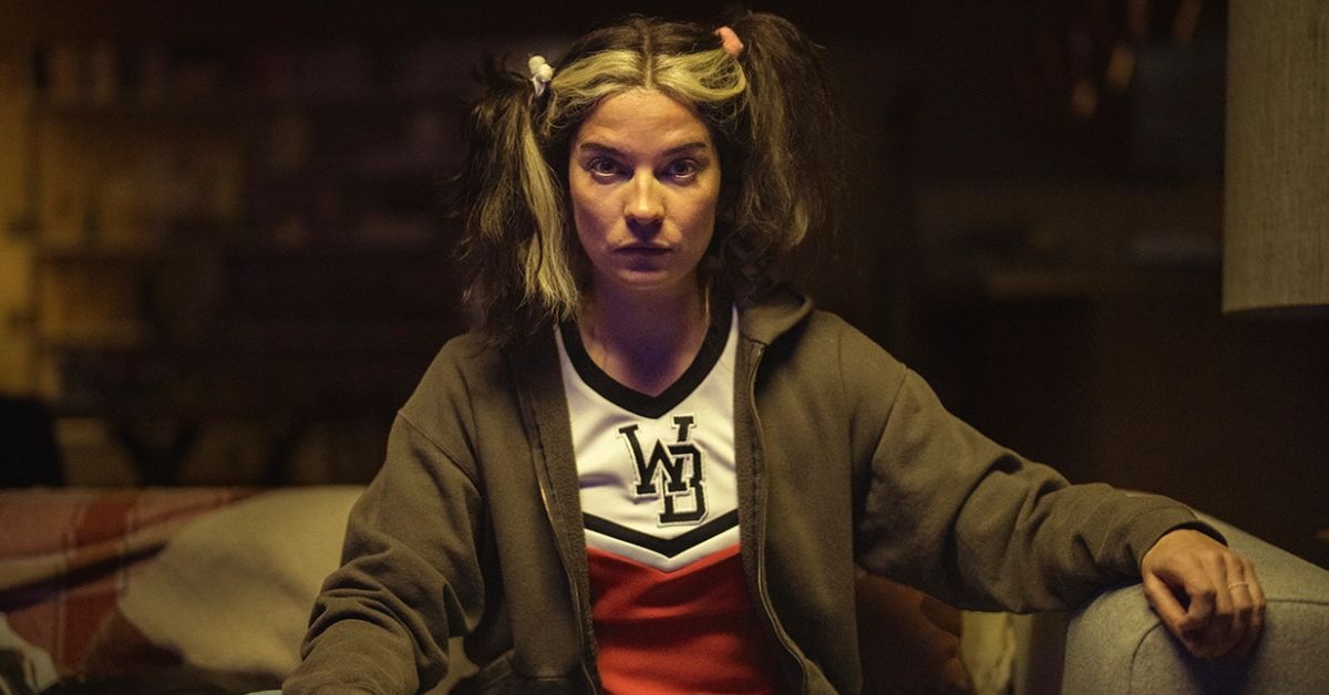 Annie Murphy on couch in pigtails from Black Mirror's "Joan Is Awful" on Netflix