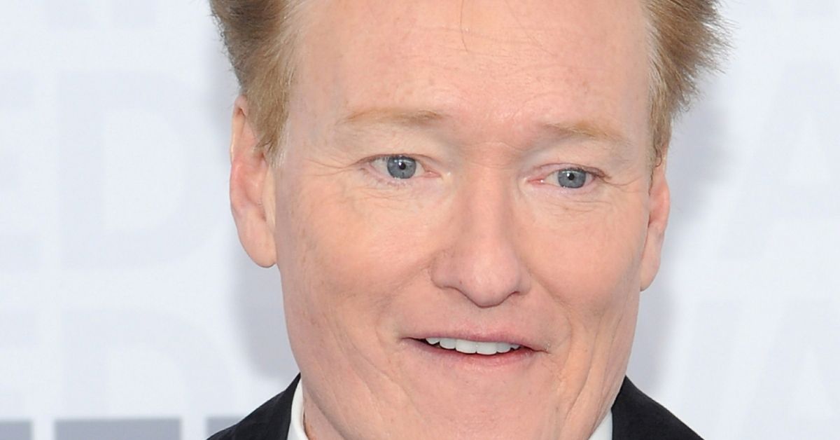 Conan O'Brien posing on a red carpet