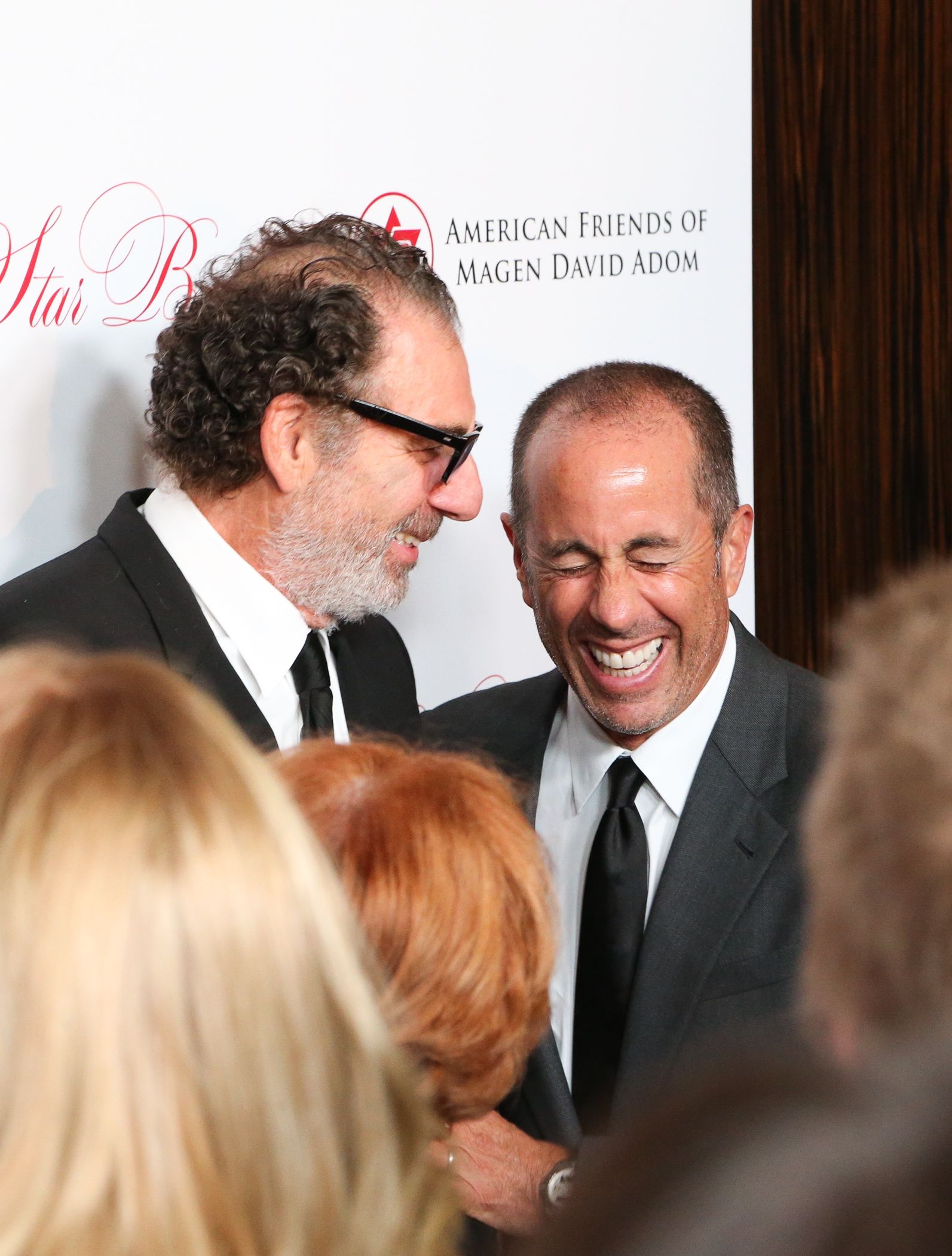 Michael Richards and Jerry Seinfeld laughing at event