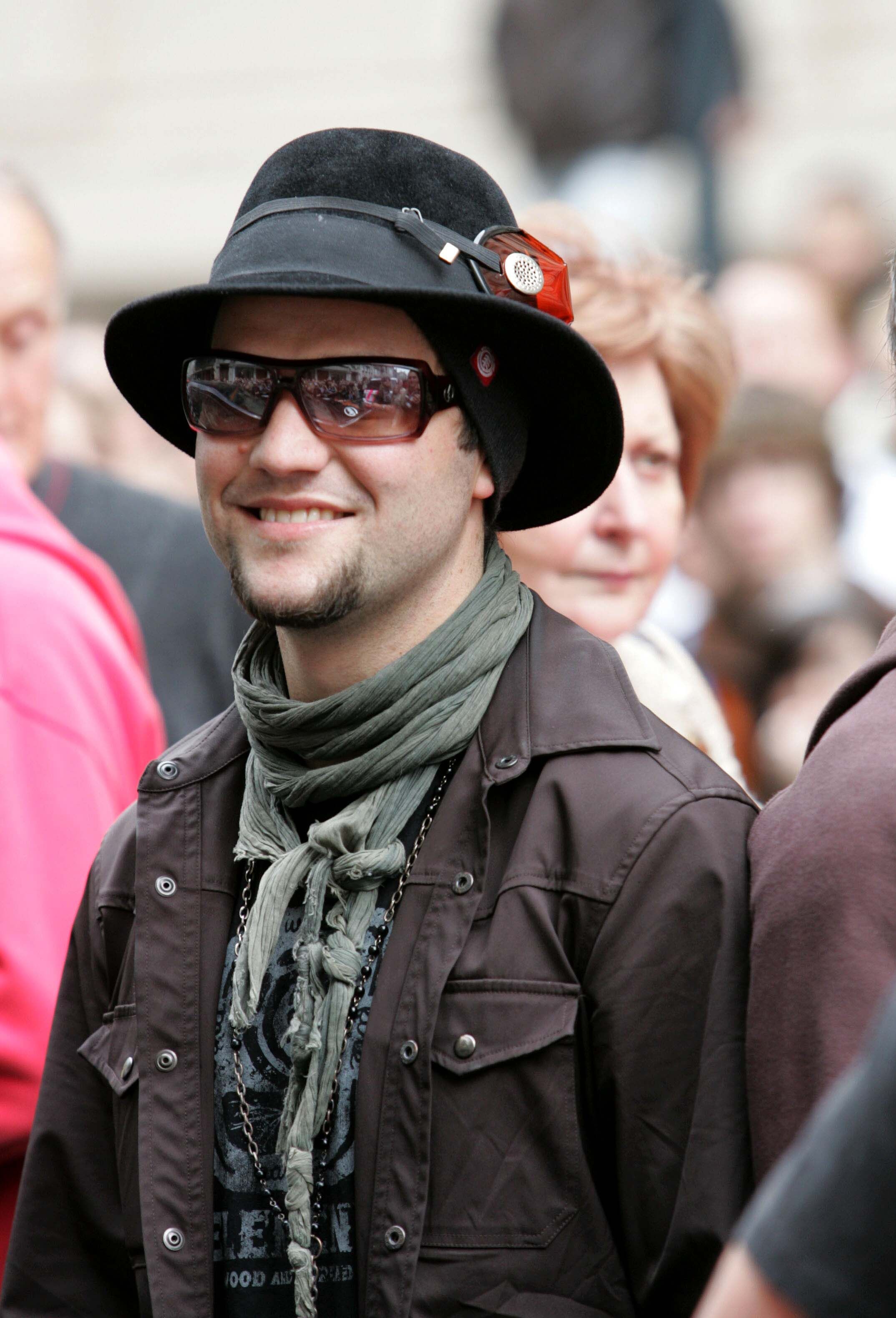 Bam Margera in a black hat smiling