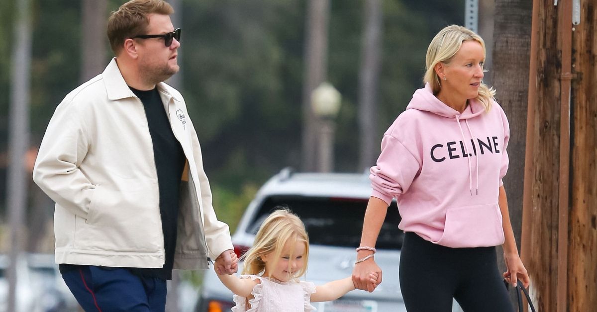 James Corden and Julia Carvey walking with daughter Charlotte