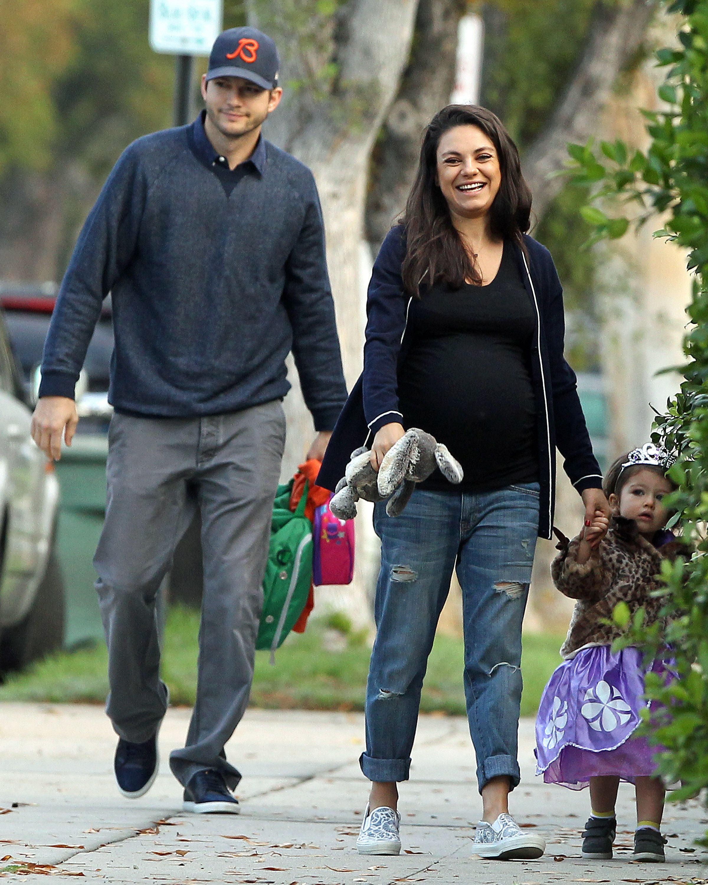 Mila Kunis and Ashton Kutcher with daughter