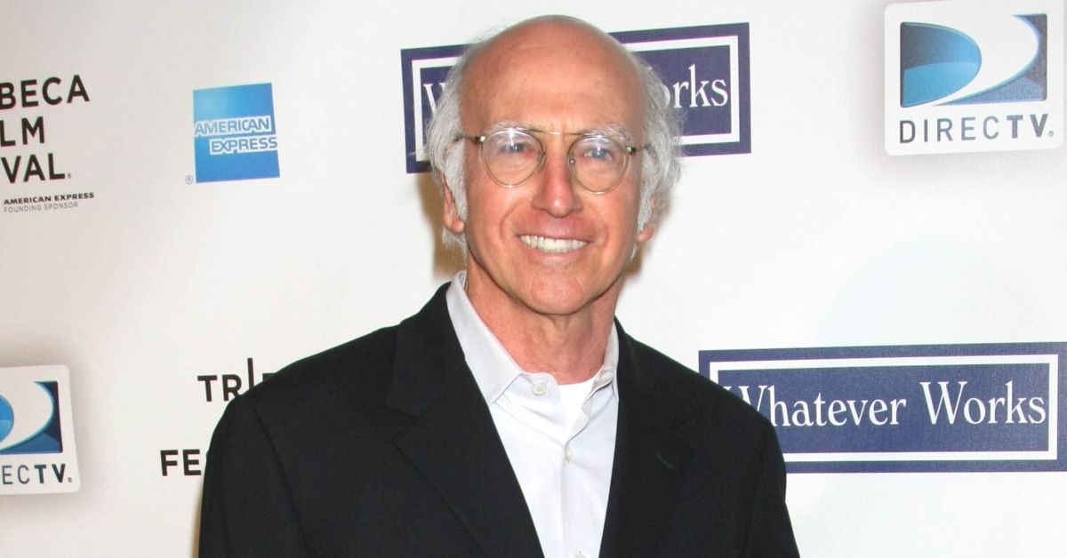 Larry David smiling on the red carpet
