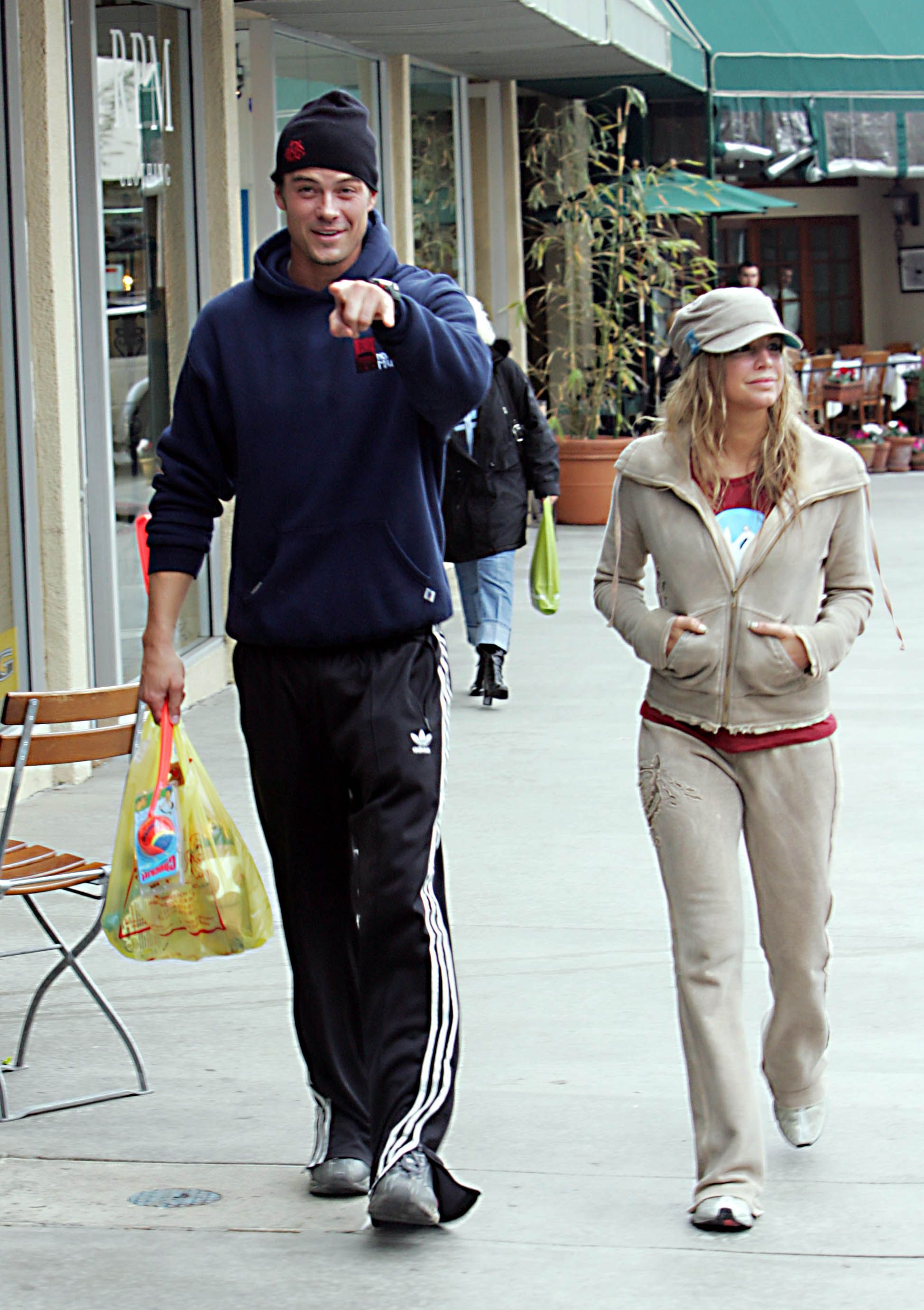 Fergie and Josh Duhamel walking down the street