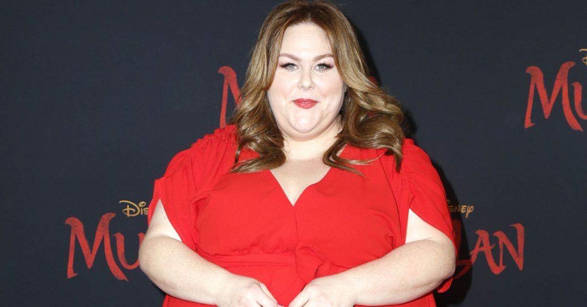 Chrissy Metz on the red carpet in a red dress