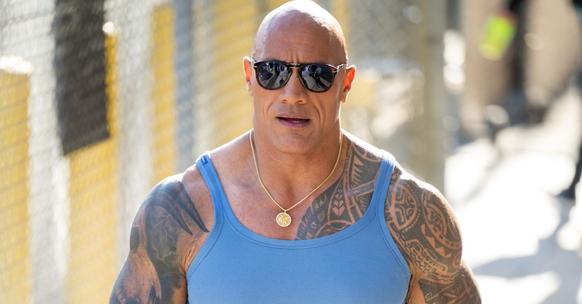 Dwayne Johnson walking in a blue tank top