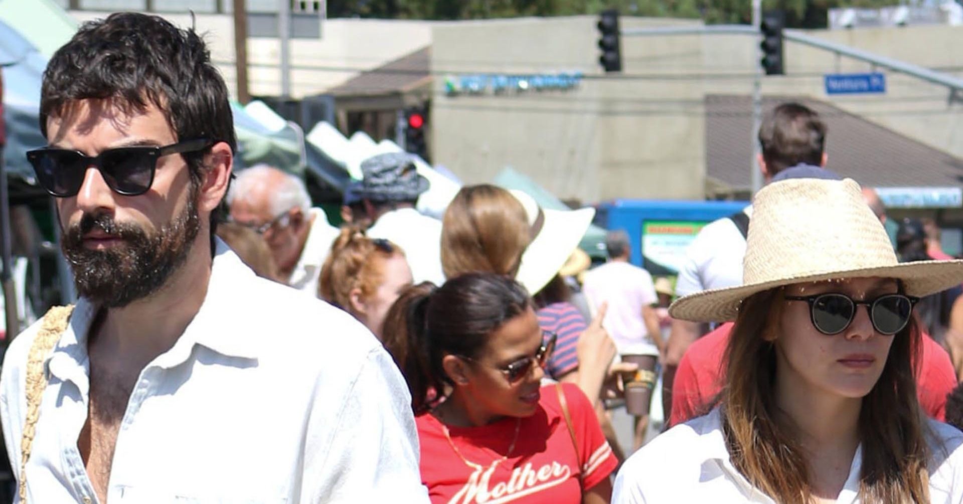 Elizabeth Olsen and Robbie Arnett walking in public at a farmer's market