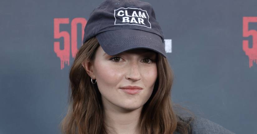 Kaitlyn Dever wearing a baseball hat at an event