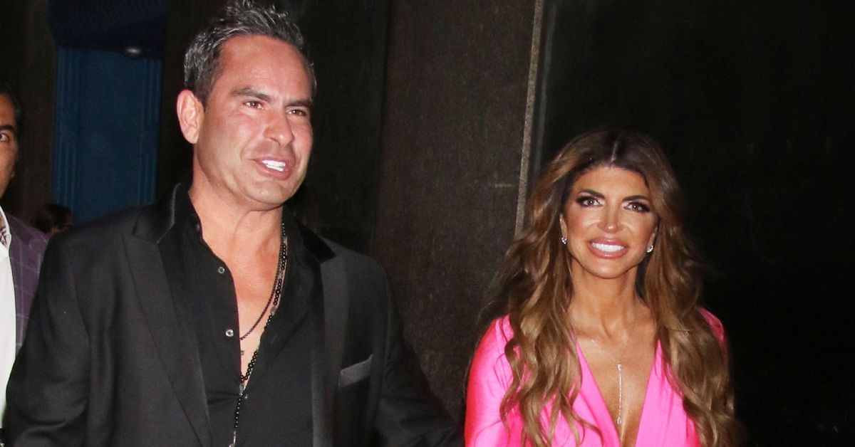 Luis Ruelas and Teresa Giudice smiling and walking together