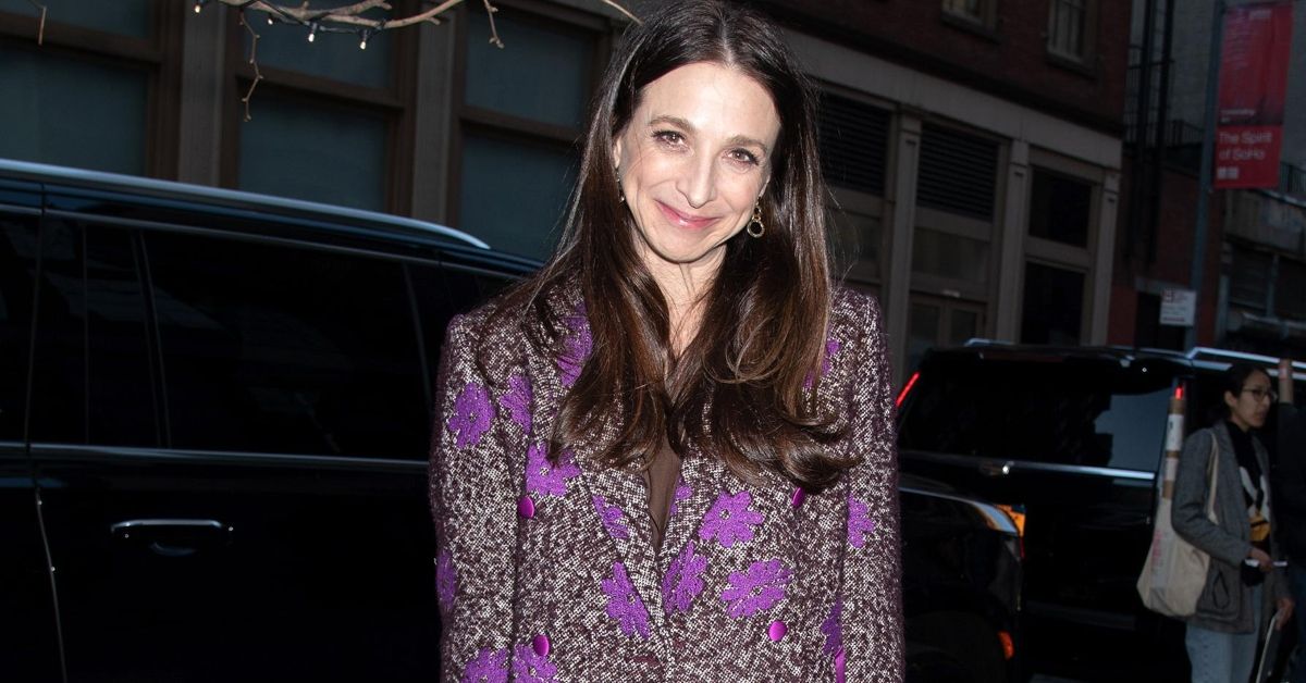 Marin Hinkle smiling and standing outside
