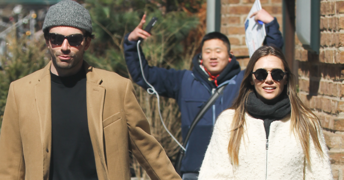 Elizabeth Olsen and Robbie Arnett walking in New York