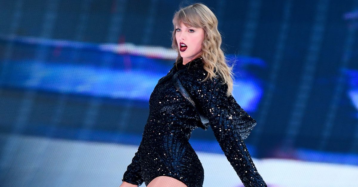 Taylor Swift performing while wearing black onstage