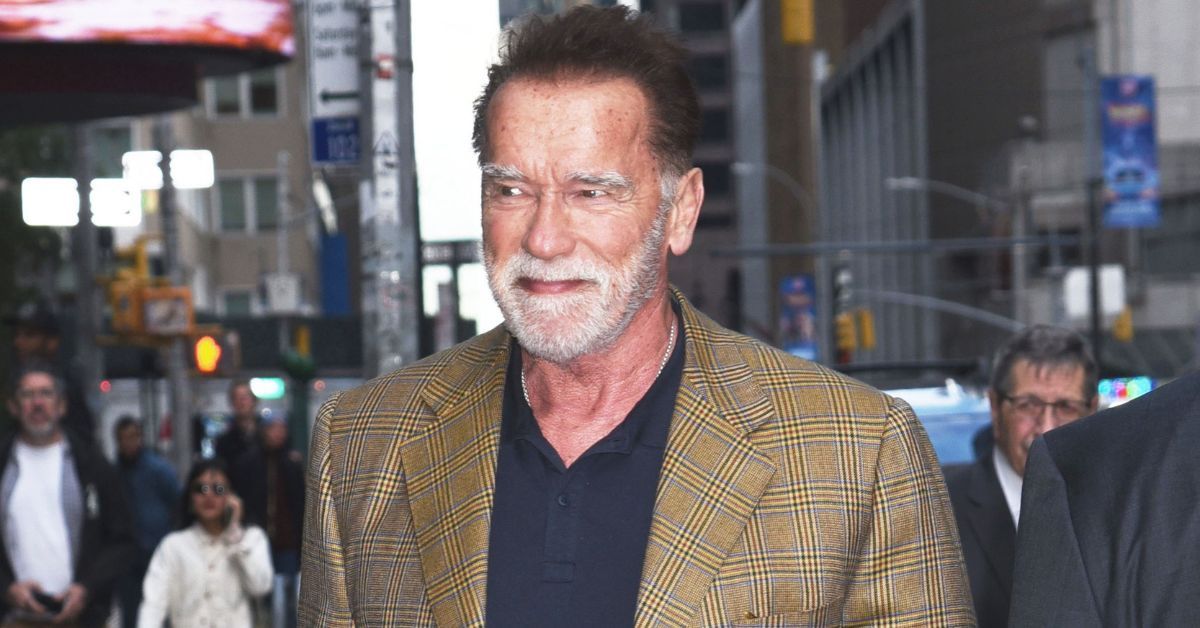 Arnold Schwarzenegger in brown plaid suit in NYC