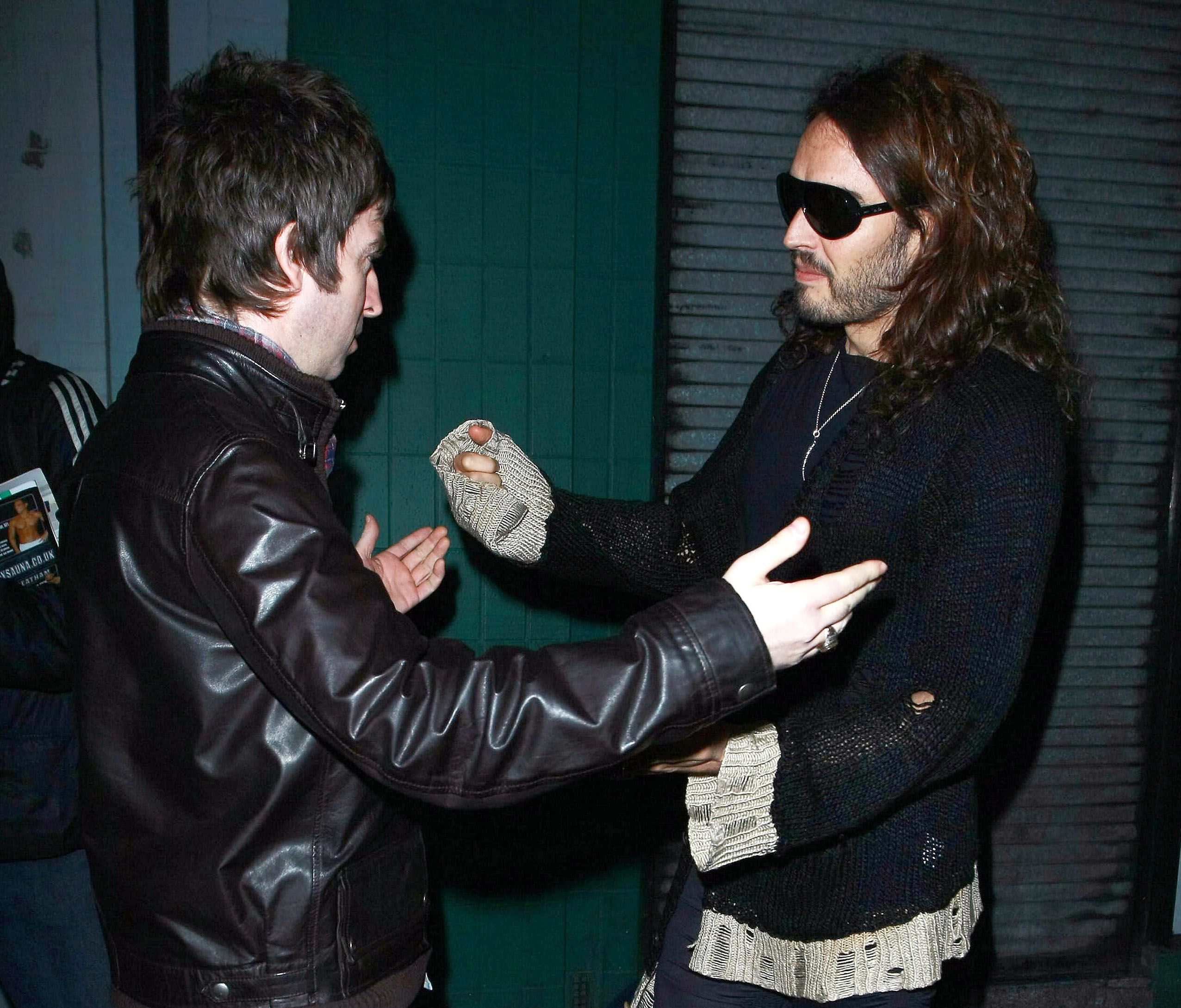 Noel Gallagher and Russel Brand spotted leaving The Groucho Club in London, UK