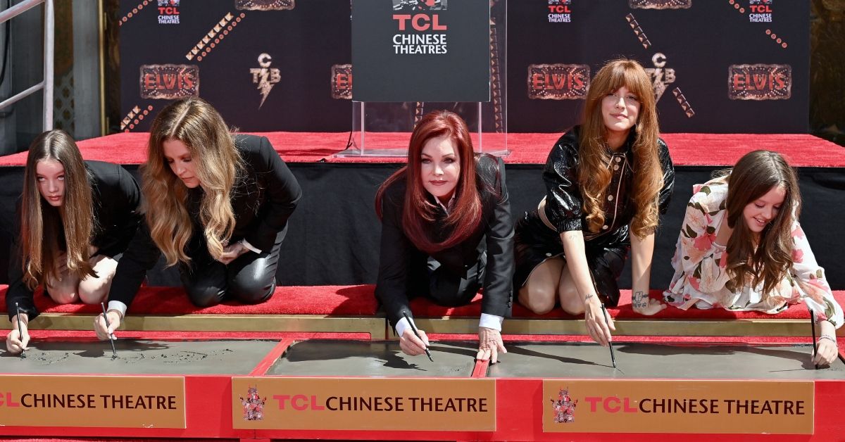Lisa Marie Presley and Priscilla Presley with their children at the TLC Chinese Theater