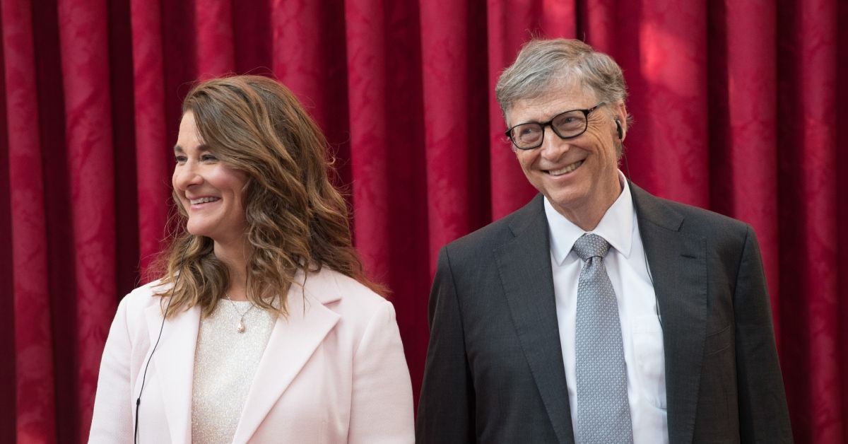 Bill Gates and Melinda Gates looking distant standing beside each other
