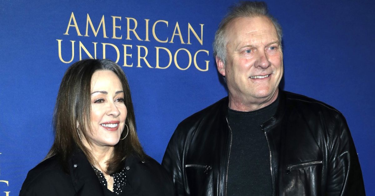 Patricia Heaton and David Hunt standing on a red carpet