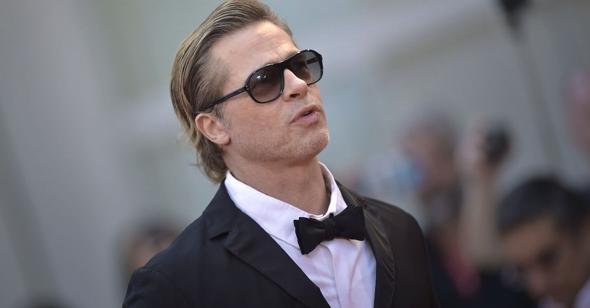 Brad Pitt standing outside at the Venice Film Festival