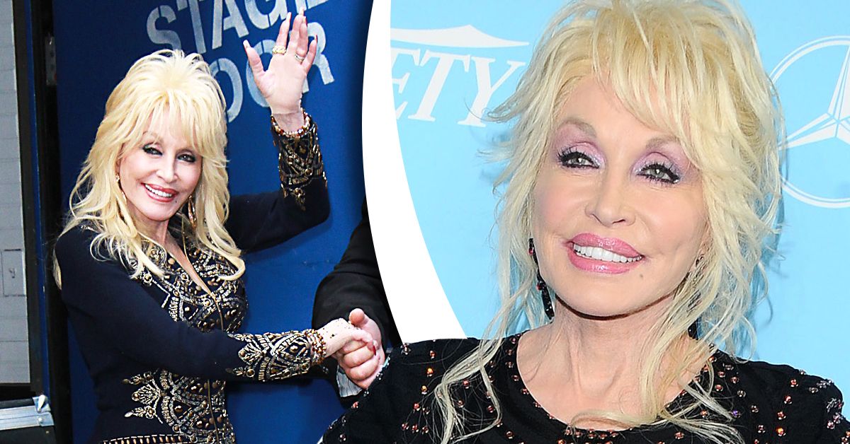 Dolly Parton shaking someone's hand and smiling