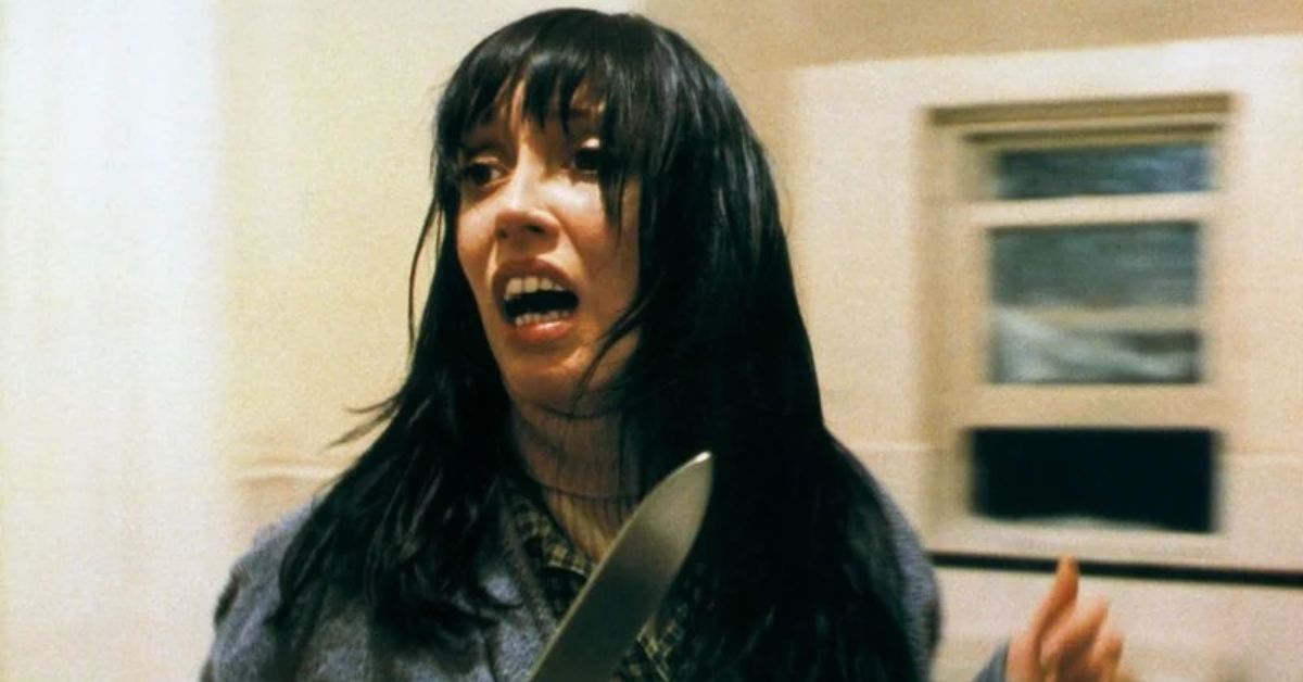 Shelley Duvall with a knife scared in The Shining