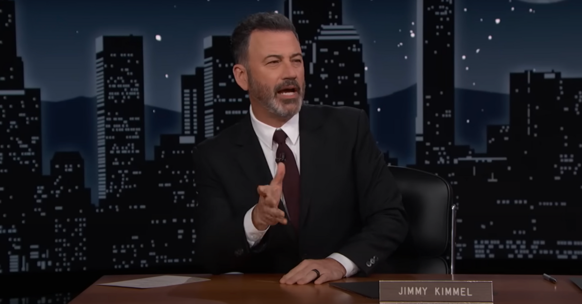 Jimmy Kimmel talking behind his desk on his late night show