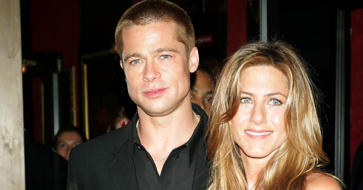 Brad Pitt and Jennifer Aniston standing in a crowd