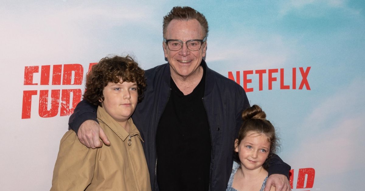 Tom Arnold smiling red carpet with son and daughter