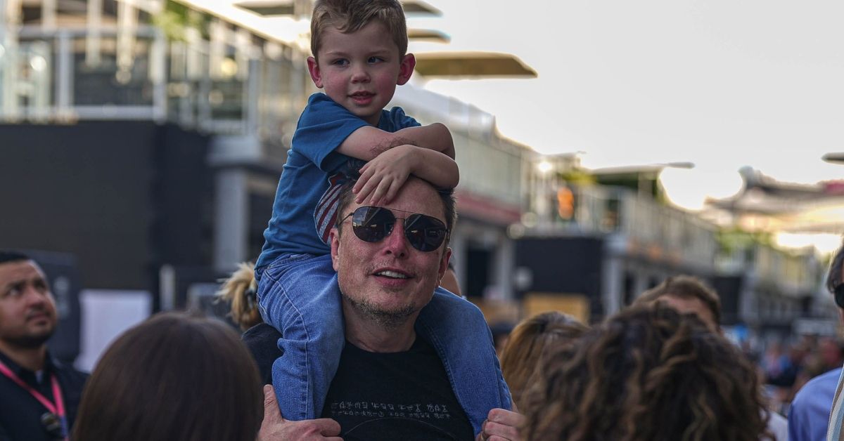 Elon Musk walks with son