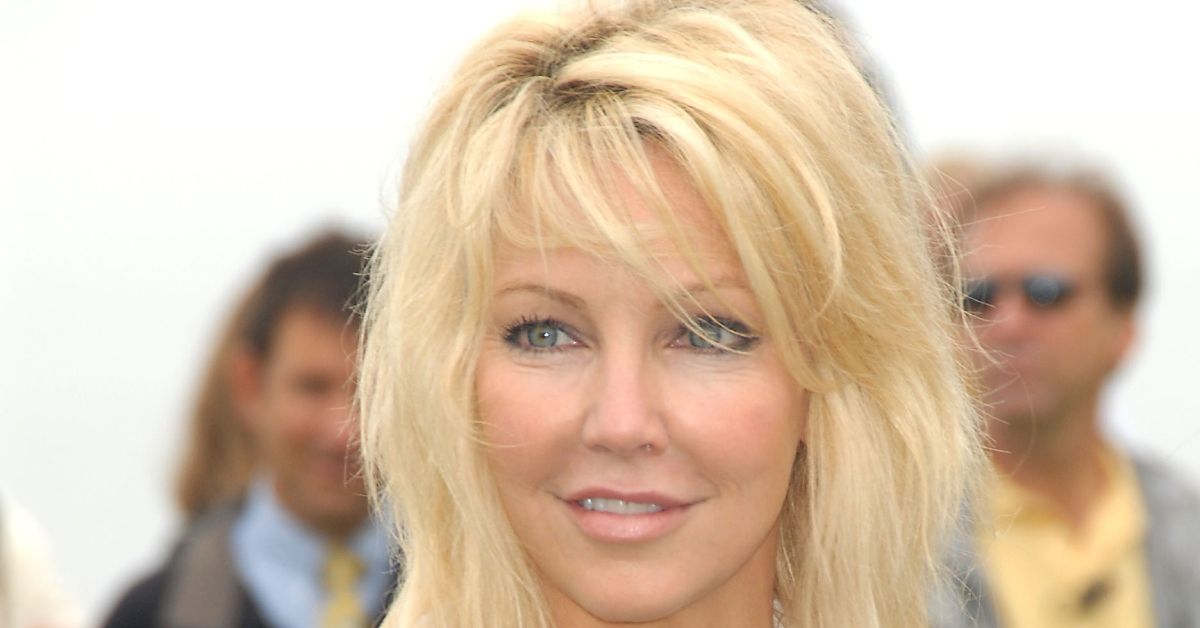 Heather Locklear posing for a photo outside