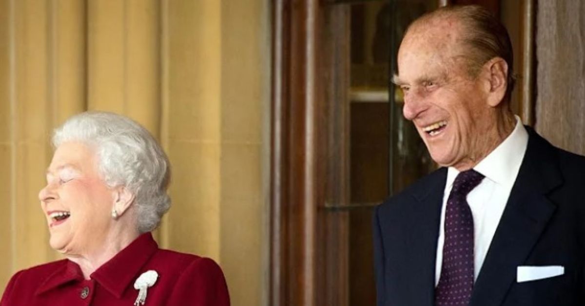 Prince Philip posing and smiling alongside Queen Elizabet II