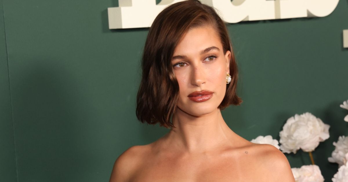 Hailey Bieber looking serious on a red carpet